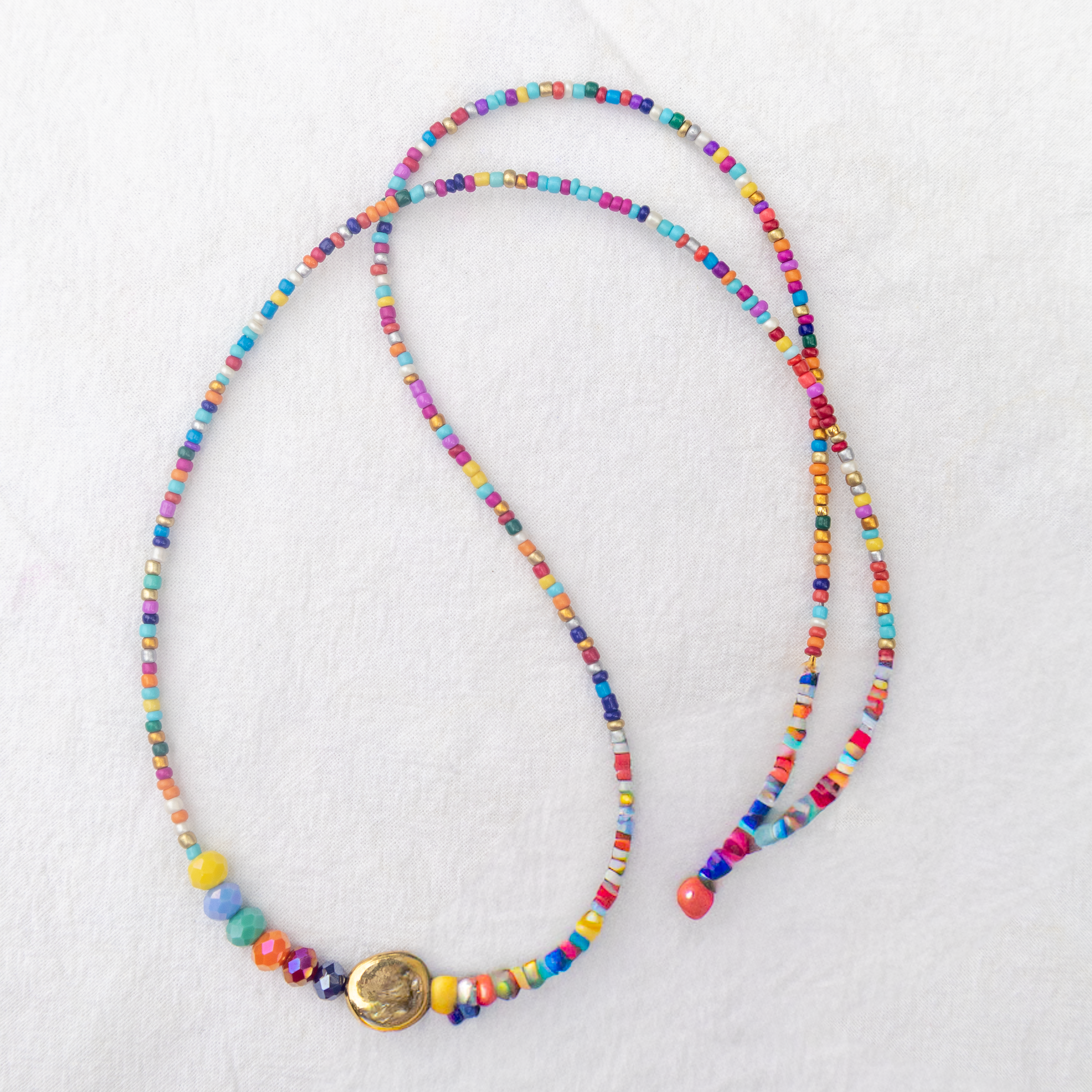 Colorful beaded necklace on a white background